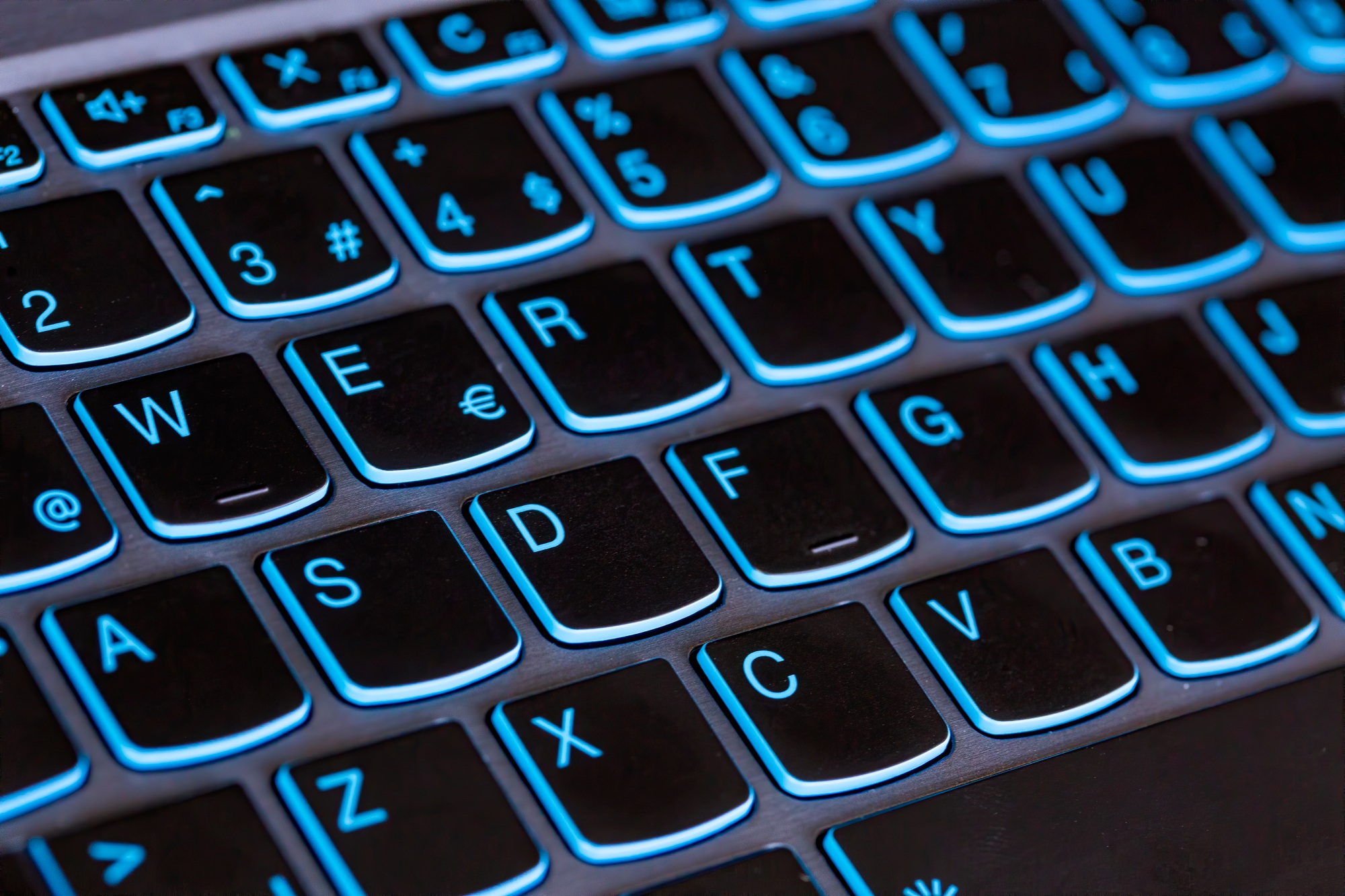 Top view of an extremely close-up computer keyboard keys